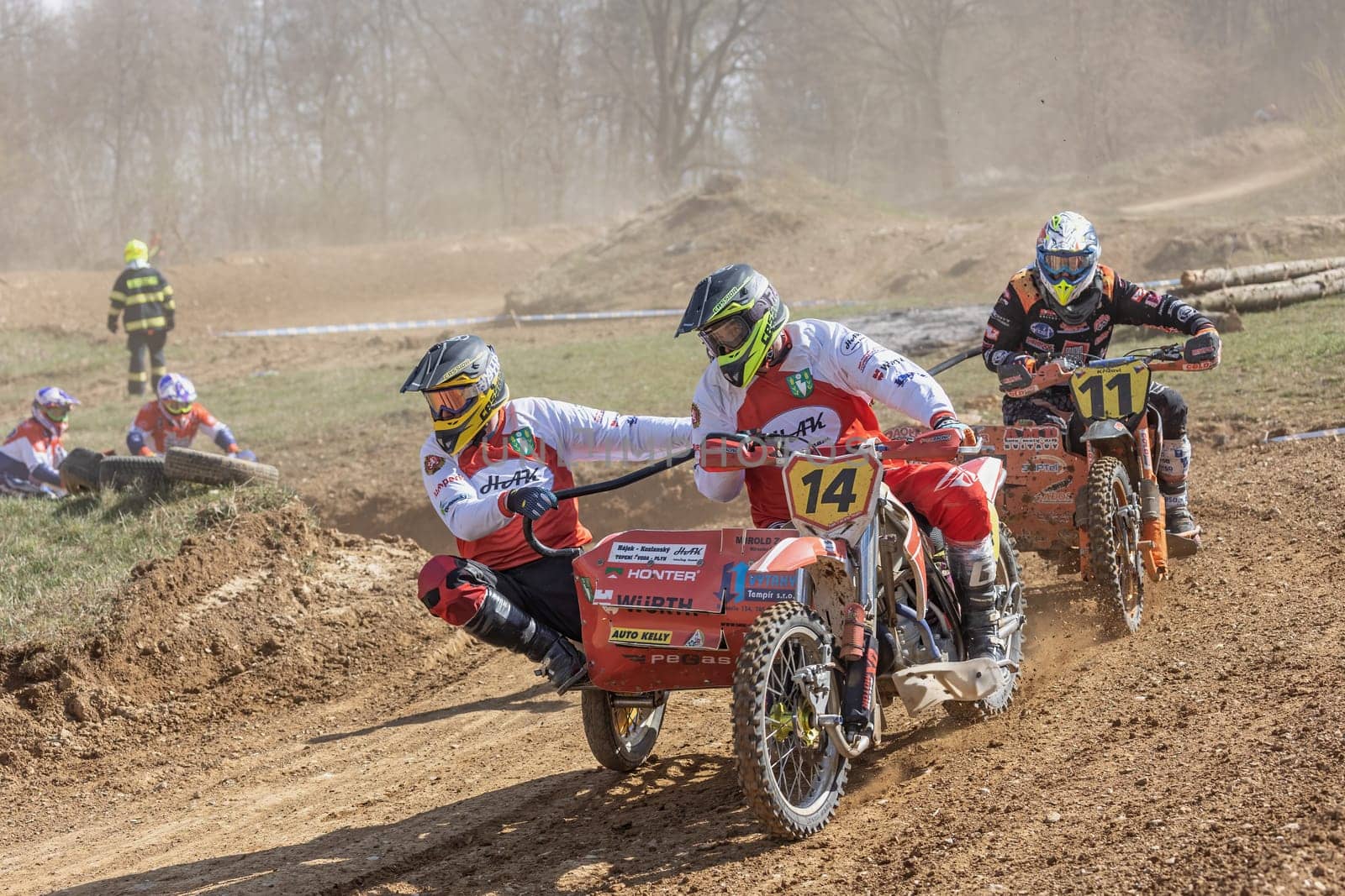 MOHELNICE, CZECH REPUBLIC - APRIL 16, 2022. Group of racers ride a sidecar in the "Sidecarcross Championship of Czech Republic"" on April 16, 2022 in the town of Mohelnice, Czech Republic."