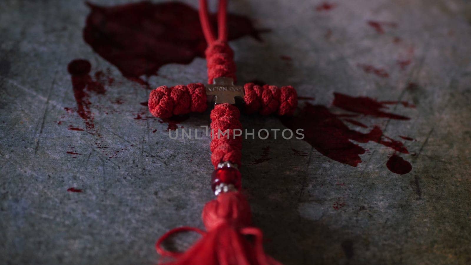 Close up of cross of jesus on bloody background