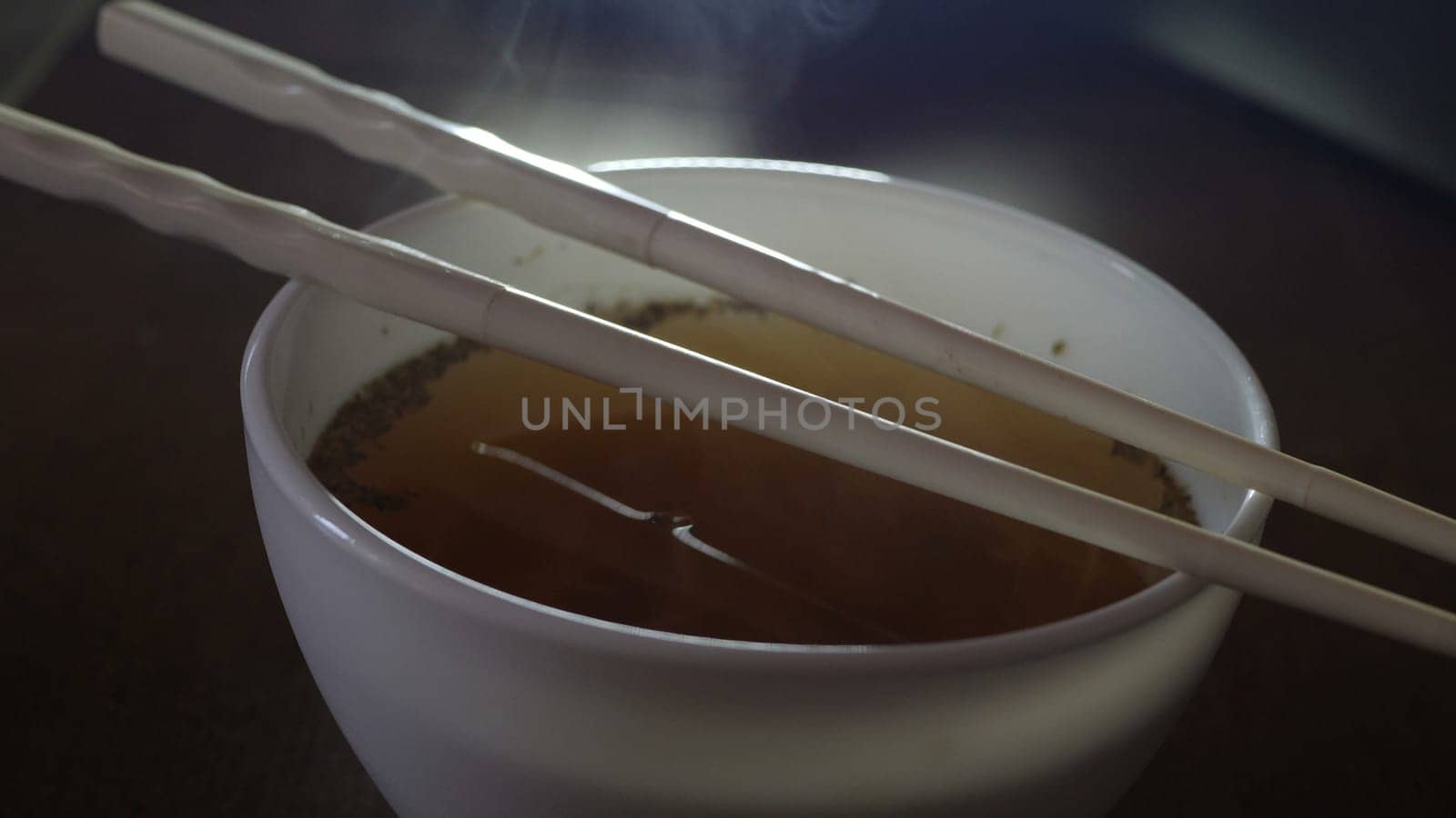 Close up of instant noodles yellow ramen and  Chinese chopsticks