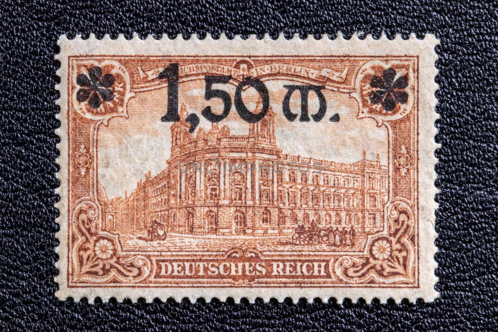 Potsdam, Germany – APR 20, 2022. Stamp year 1920 of the German Reichspost. Representative Figures of the German Empire, Reichspostamt Berlin with new value grade 1.50 Mark, issue date from June 1920. Macro.