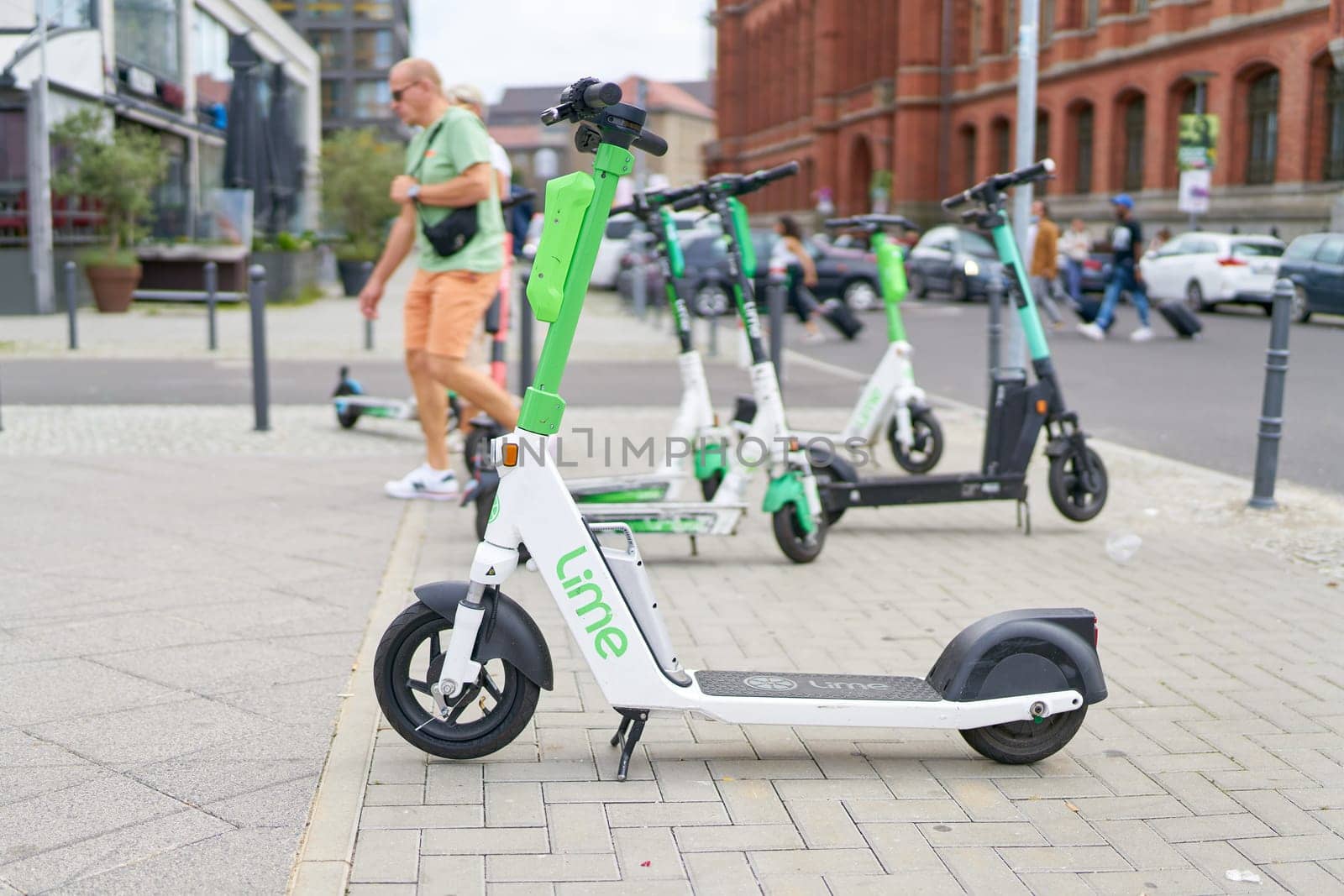 Parked electric scooter of the Lime group in the city center of Berlin