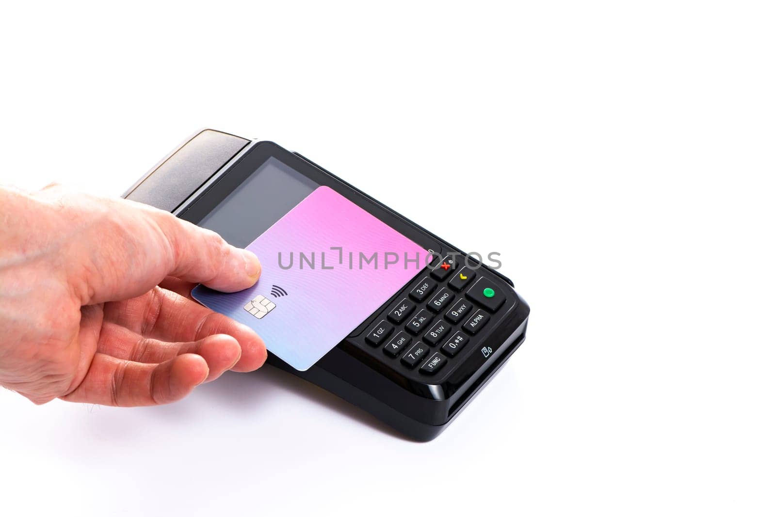 Attached plastic card to the payment terminal with a man's hand on a white isolated background, copy space. High quality photo