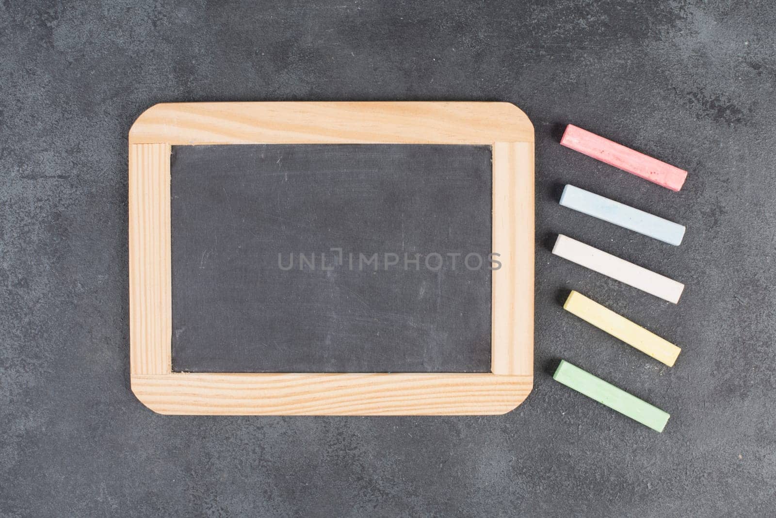 Blank blackboard, copy space for text, advertising business, education concept, school class, empty background for a message, colorful chalk