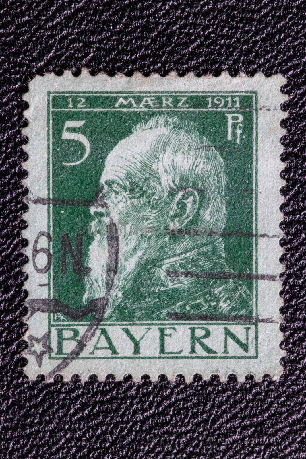Potsdam, Germany - APR 26, 2022. German Empire. Close-up of a stamp showing a portrait of Luitpold Karl Joseph Wilhelm of Bavaria, on the occasion of his 90th birthday on 12 March 1911.