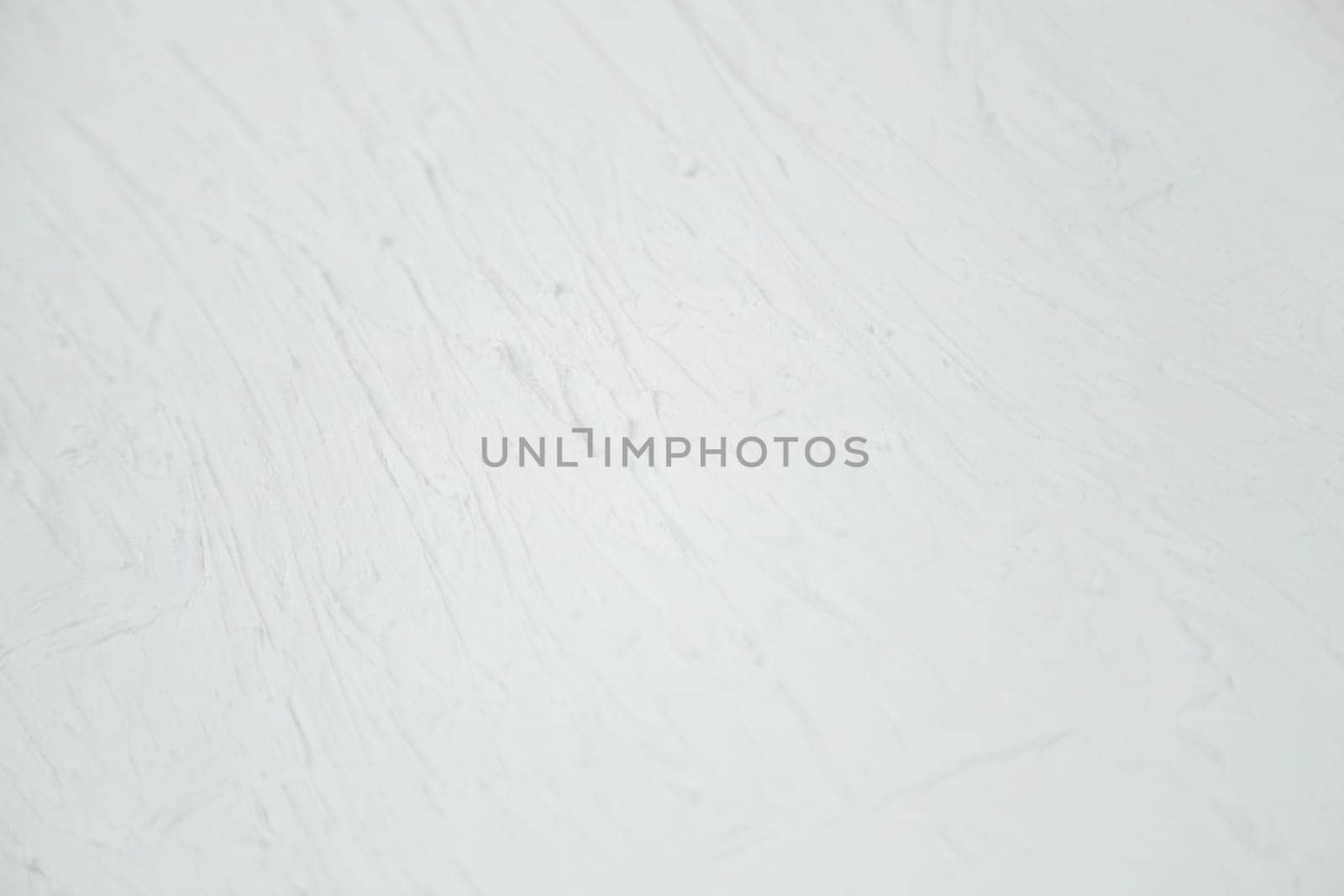 White background with a non-uniform texture. High quality photo