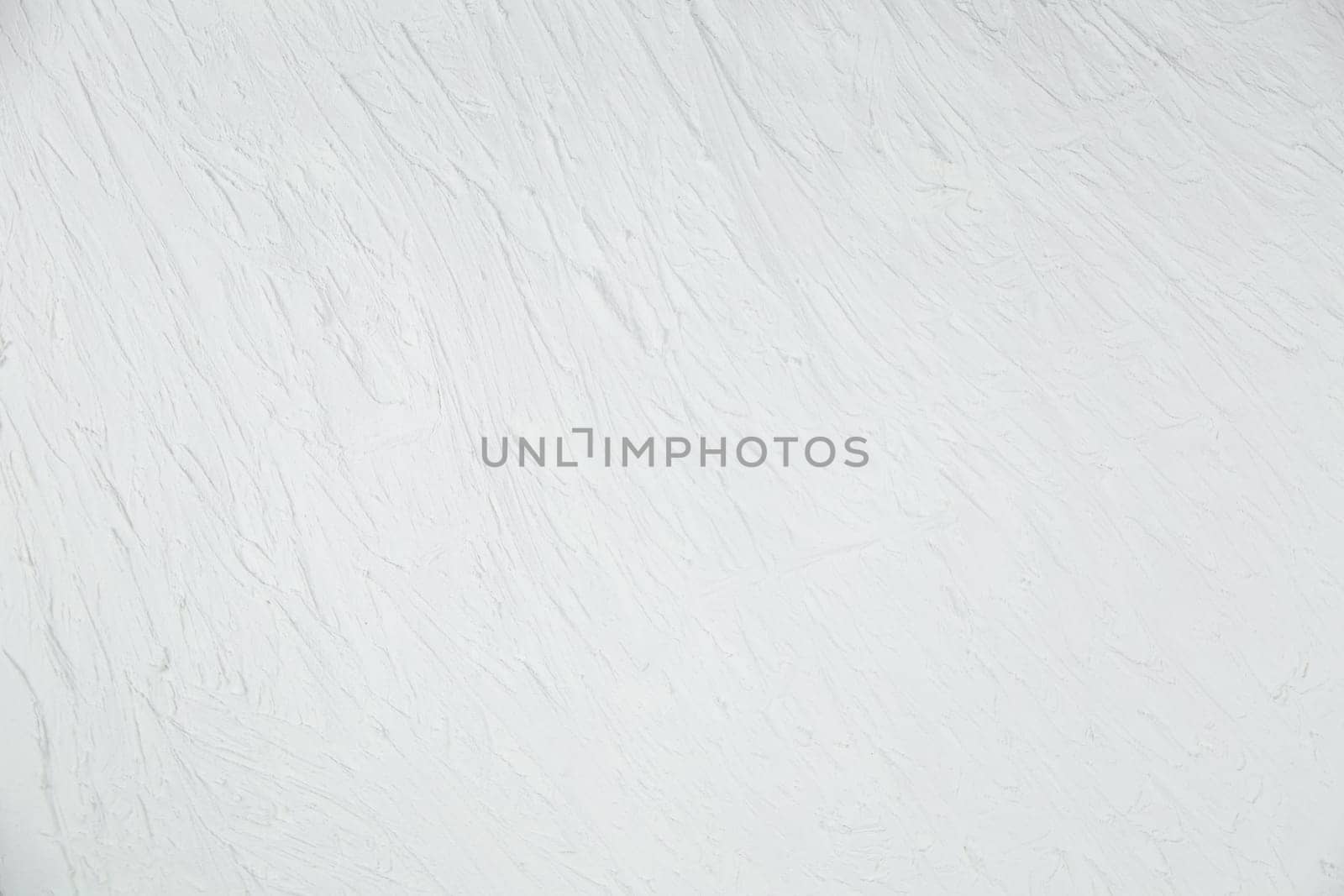 White background with a non-uniform texture. High quality photo