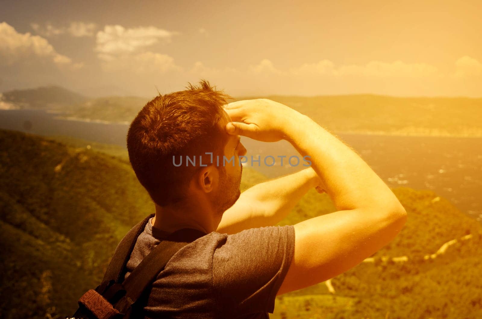 Backpack traveler enjouing the nature and looking at horizone