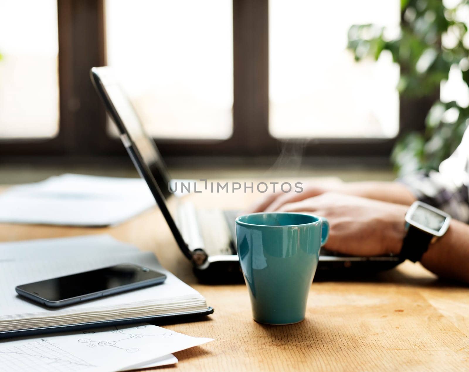 Working desk with laptop, notbook and coffe cup.