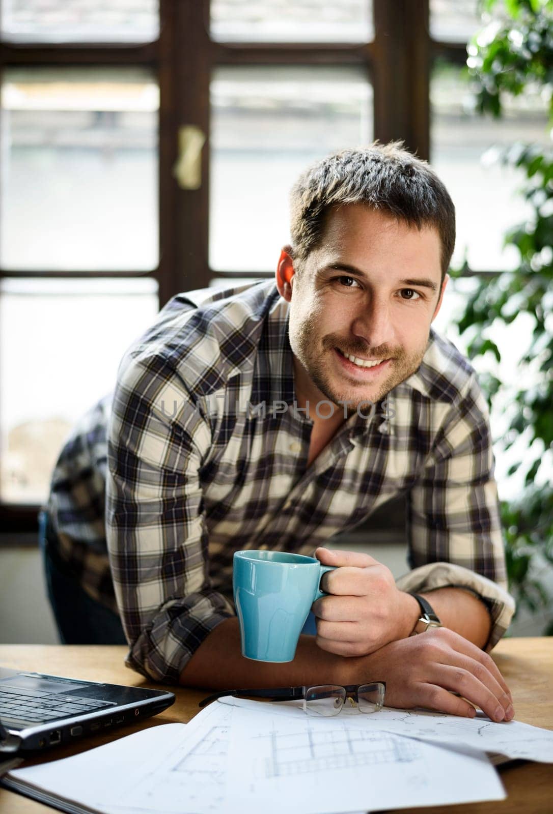 Young man working in cool workspace