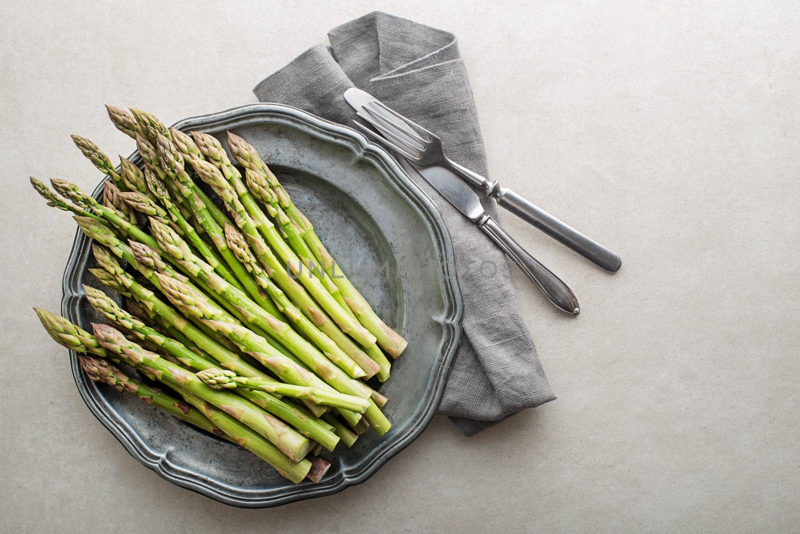 Fresh of green Asparagus in plate. Cooking healthy meal. Bunches of green asparagus, top view- Image