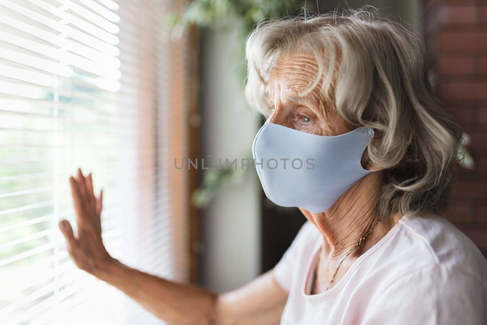 Elderly woman with a face mask during lockdown