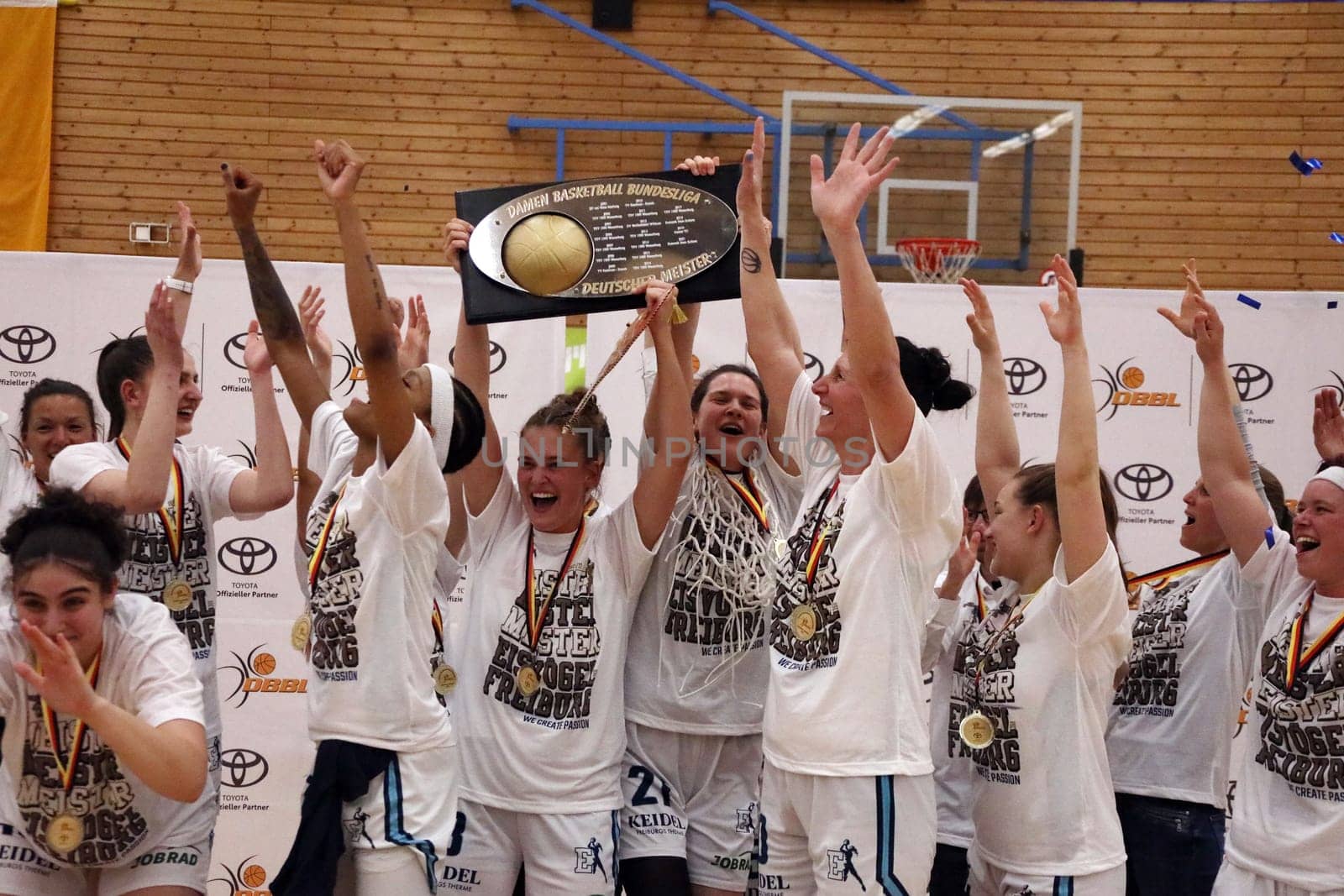 High the board,the players of the Eisvögel Freiburg celebrate their first German championship title after the game of the 1.BBL Women 2021/2022 - Eisvoegel USC Freiburg - Rheinland Lions. .. Photo: Joachim Hahne/johapress
