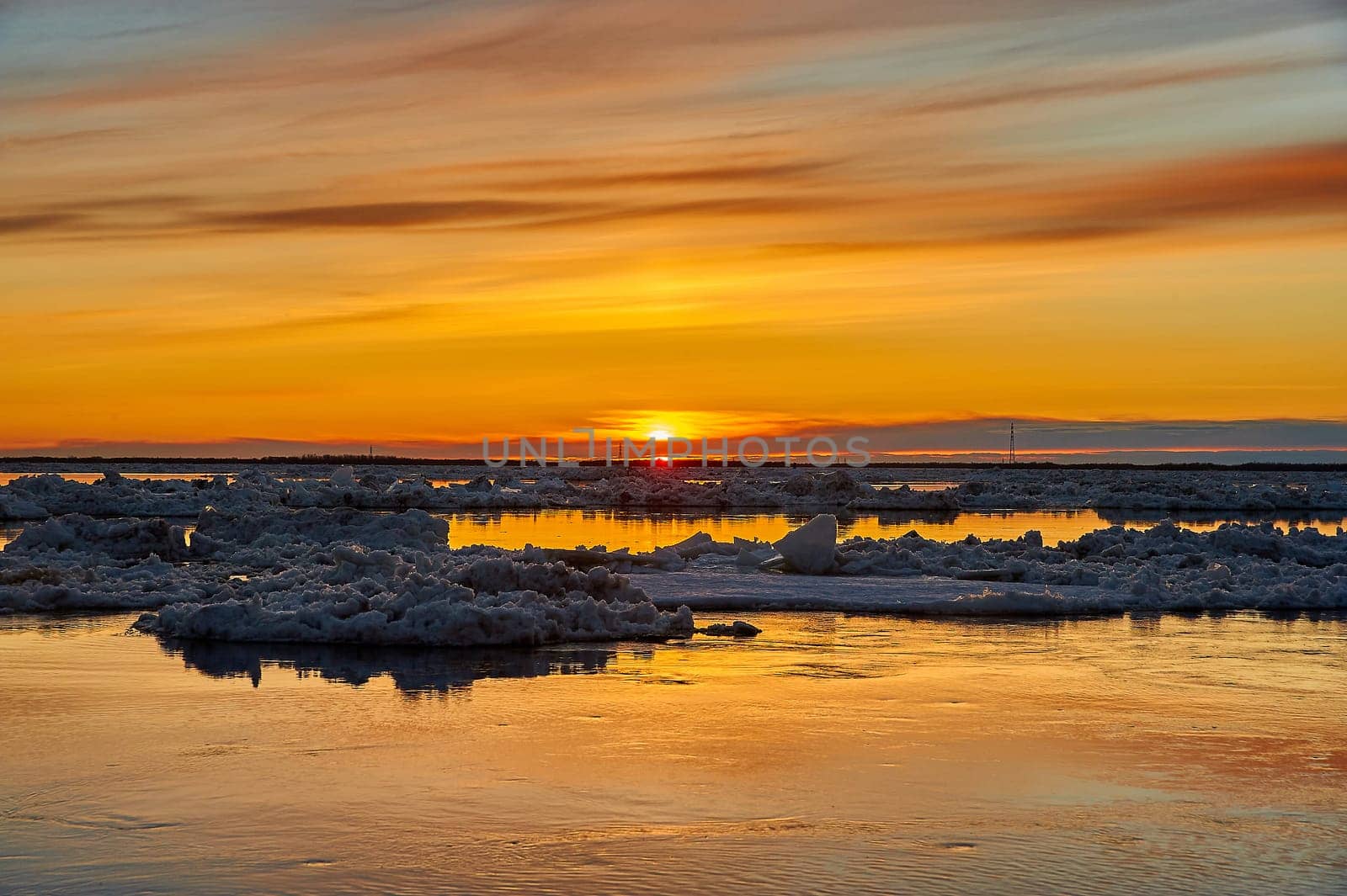 Sunset on the river during an ice drift. High quality photo