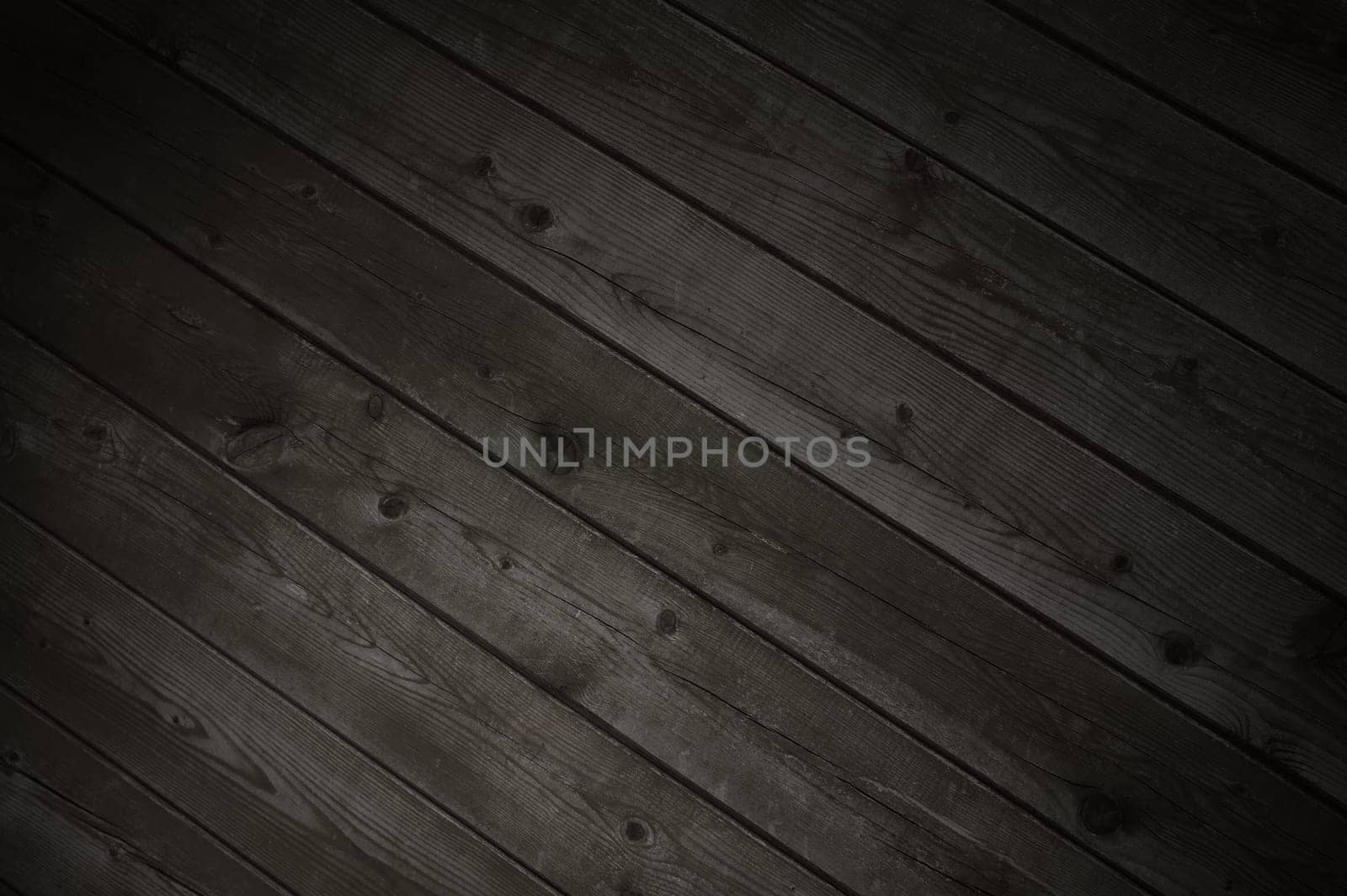 Dark diagonal wooden planks with grey brown color