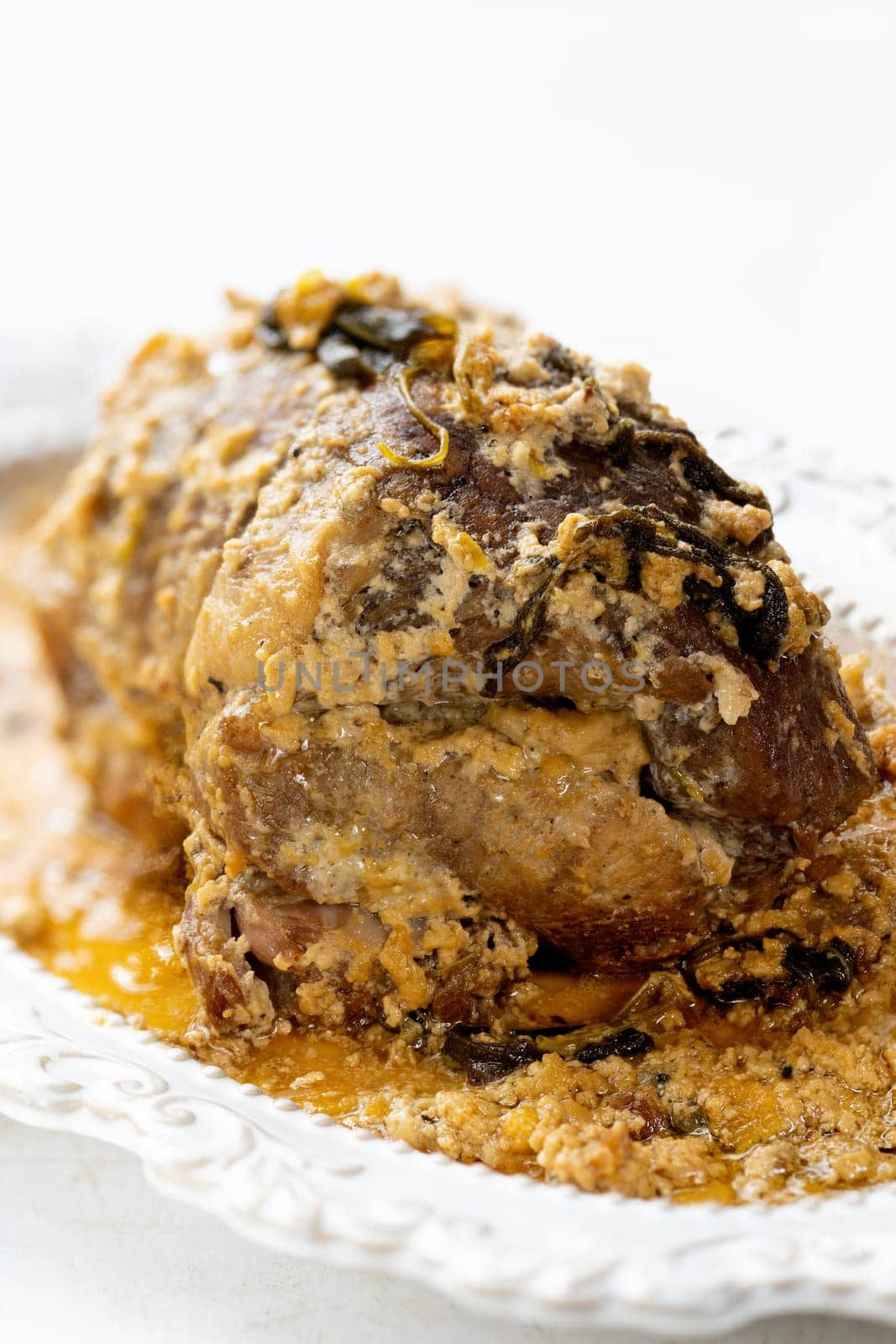 close up of rustic italian pork shoulder  in milk
