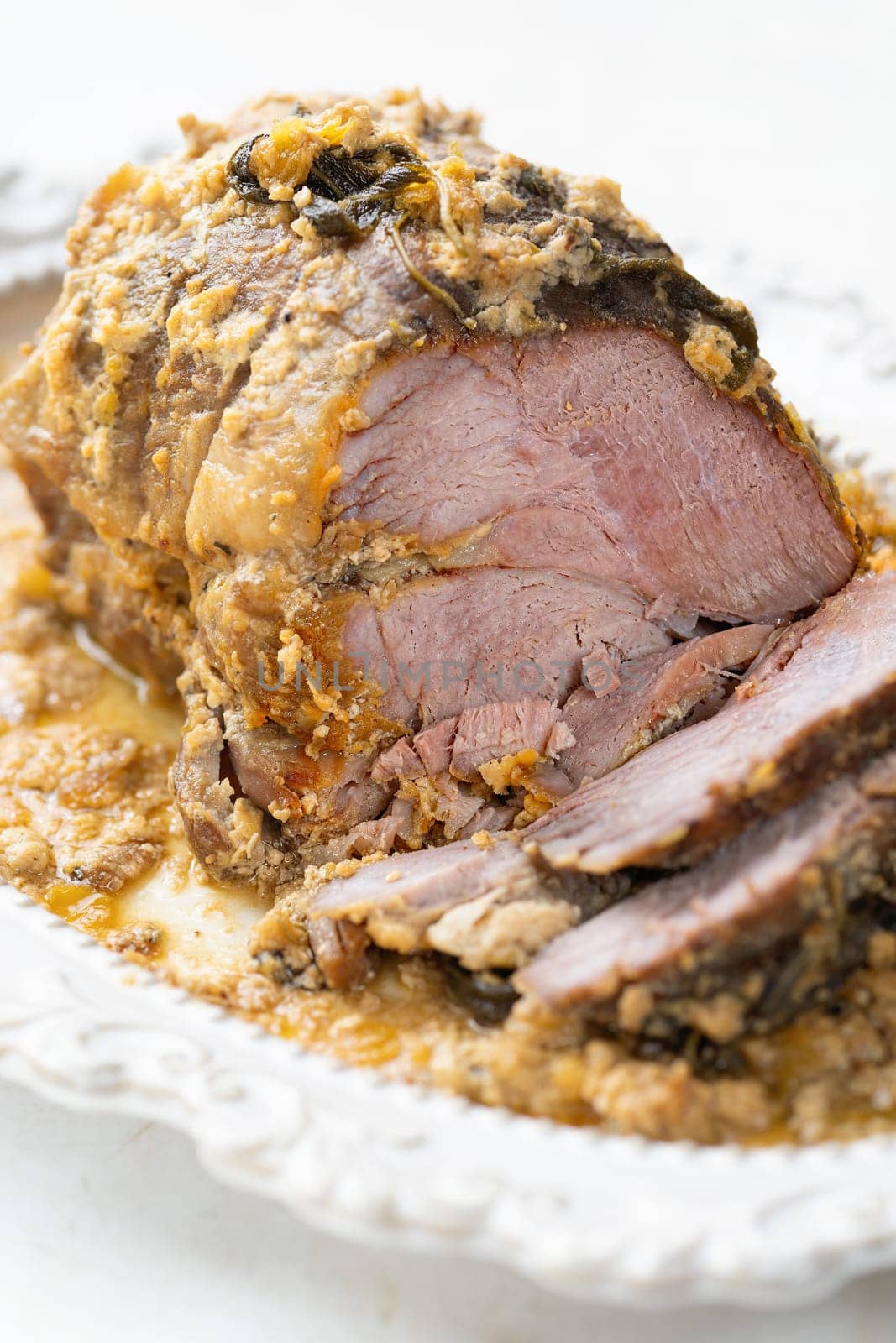 close up of rustic italian pork shoulder  in milk
