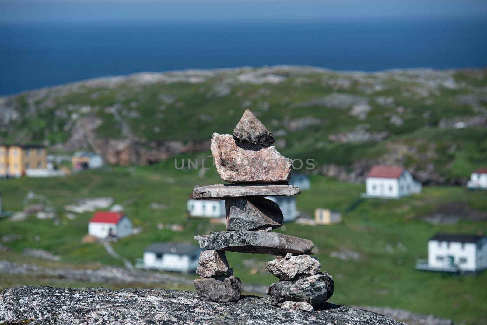 Inukshuk oversees Battle Harbor Newfoundland and Labrador