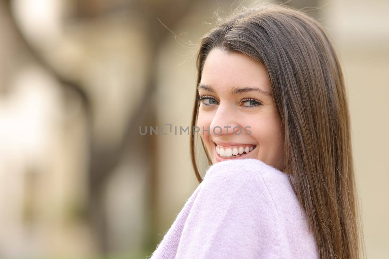 Portrait of a candid teenage female looking at you