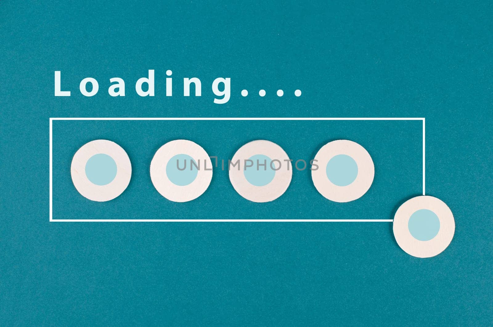 The word loading is standing over the progress bar, hand puts last cube to the row, business, education and marketing concept download a new program