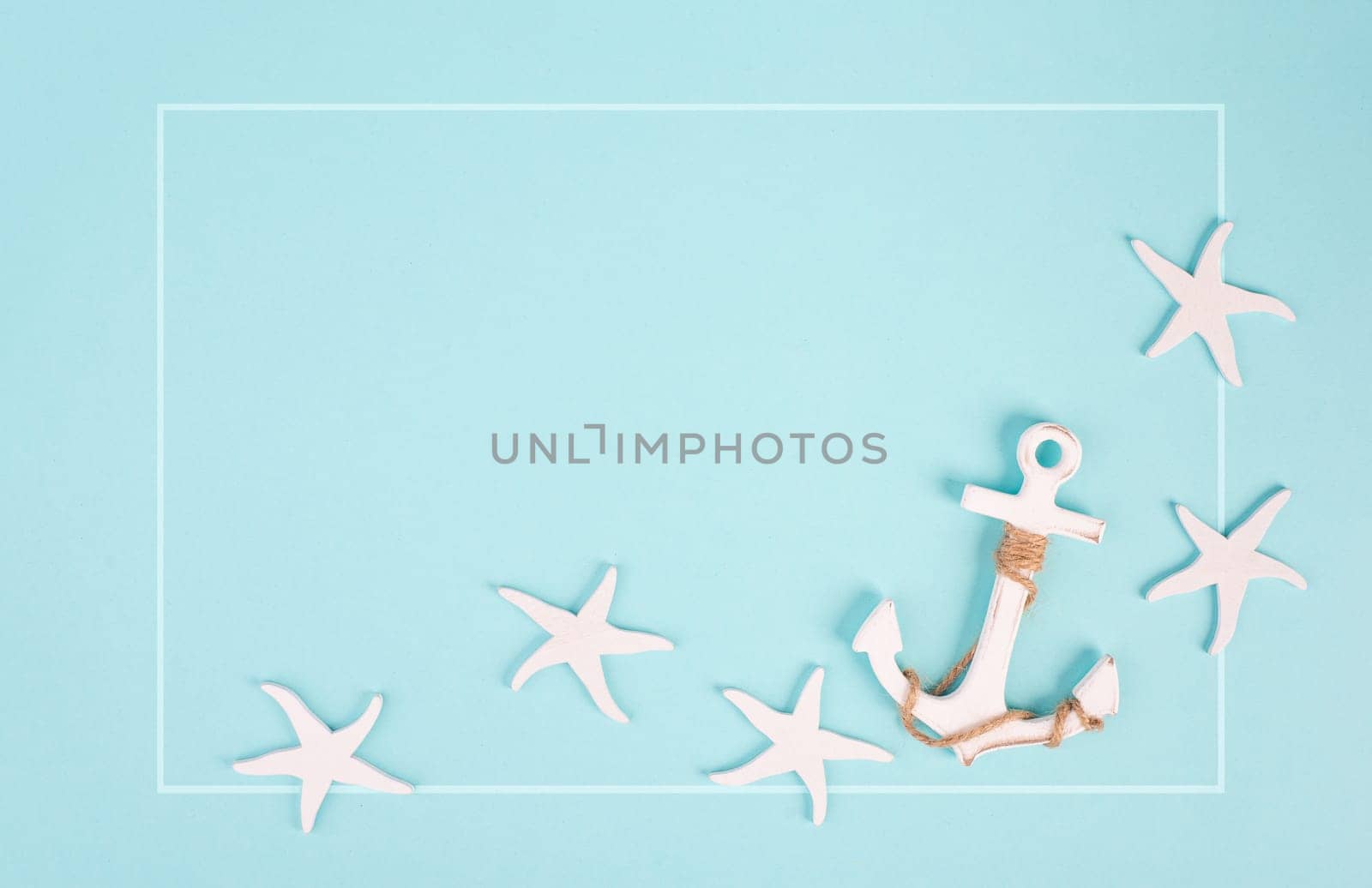 Blue colored summer and vacation background, anchor and sea stars building a frame, copy space for text, holiday and tourism concept