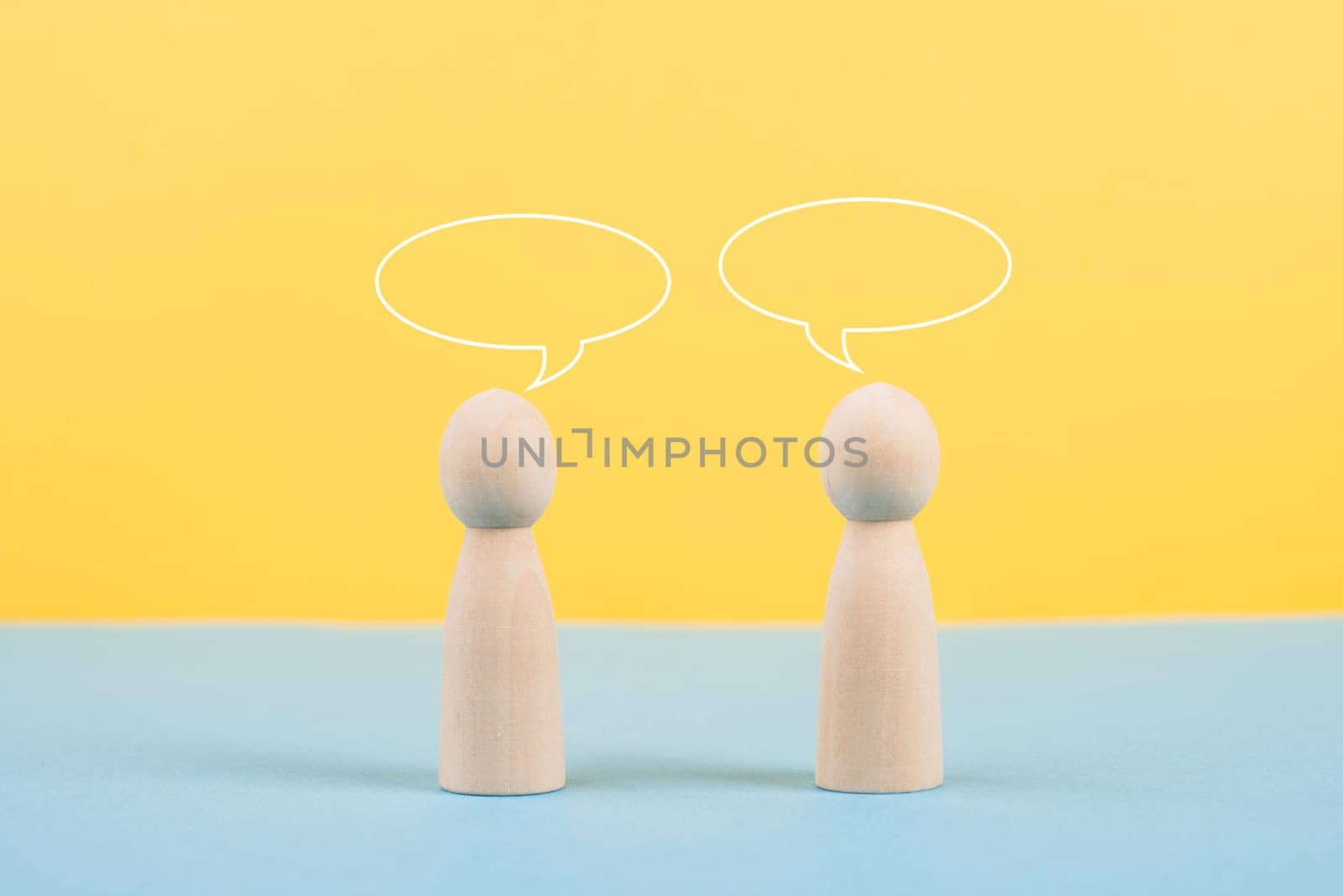 Two people talking together, empty speech bubbles, having a conversation, networking and teamwork concept, social issue