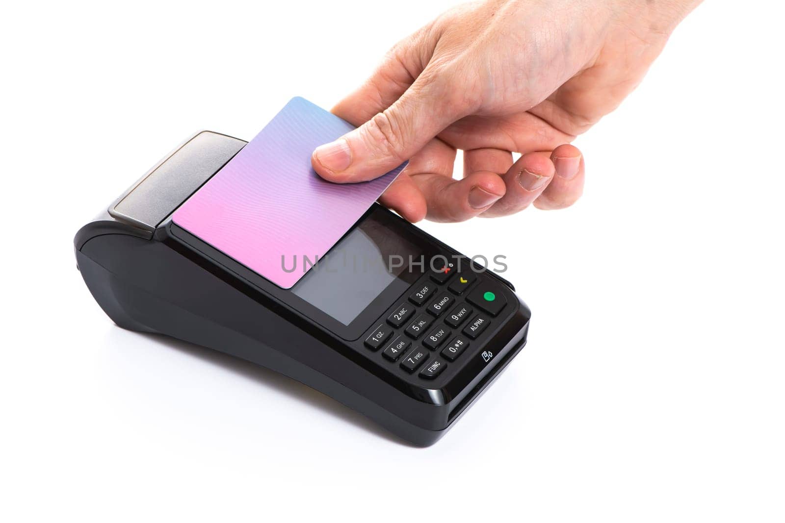 Attached plastic card to the payment terminal with a man's hand on a white isolated background, copy space. High quality photo