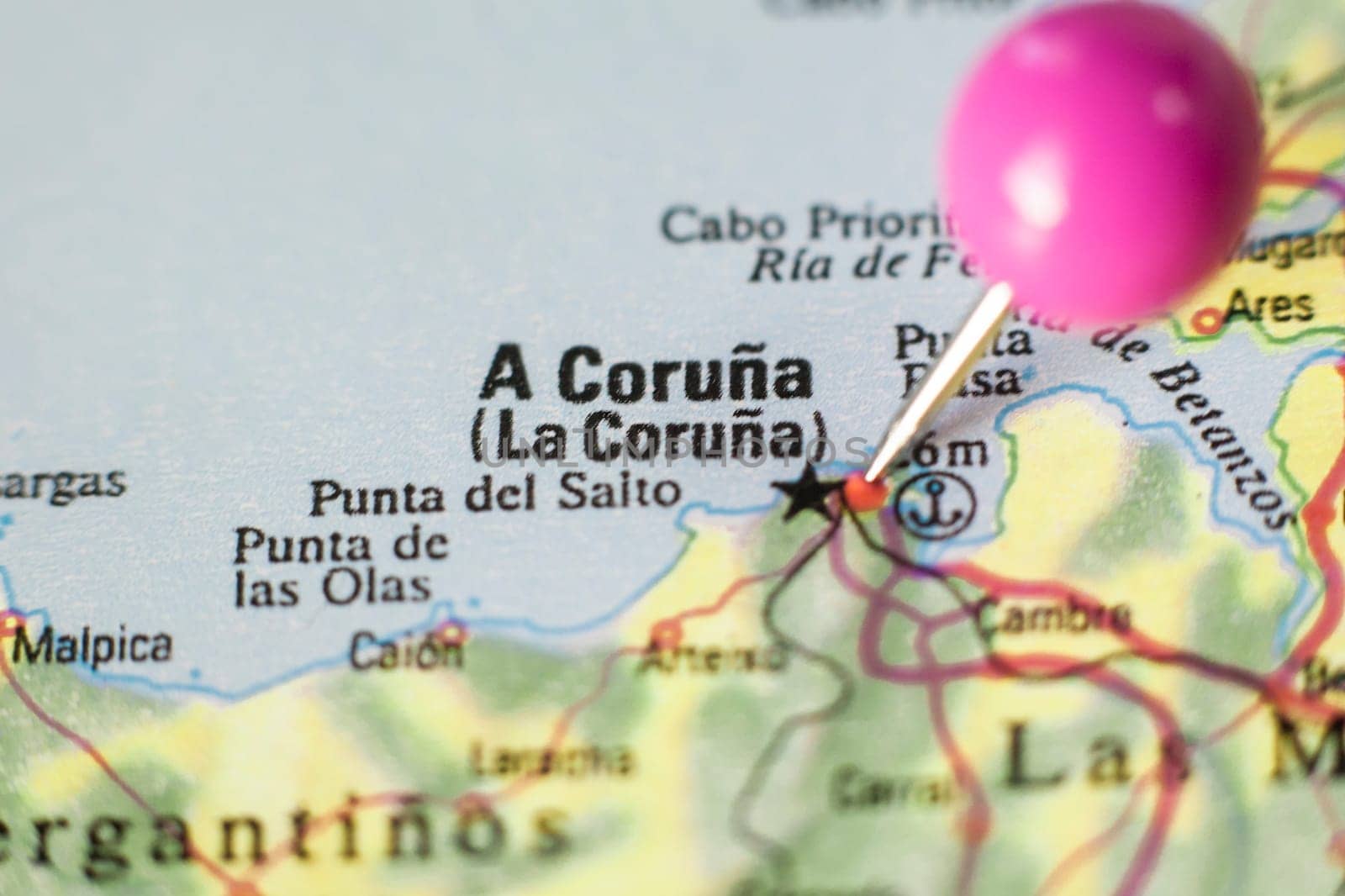 Pushpin marking on A Corunna, Spain. Selective focus on city name