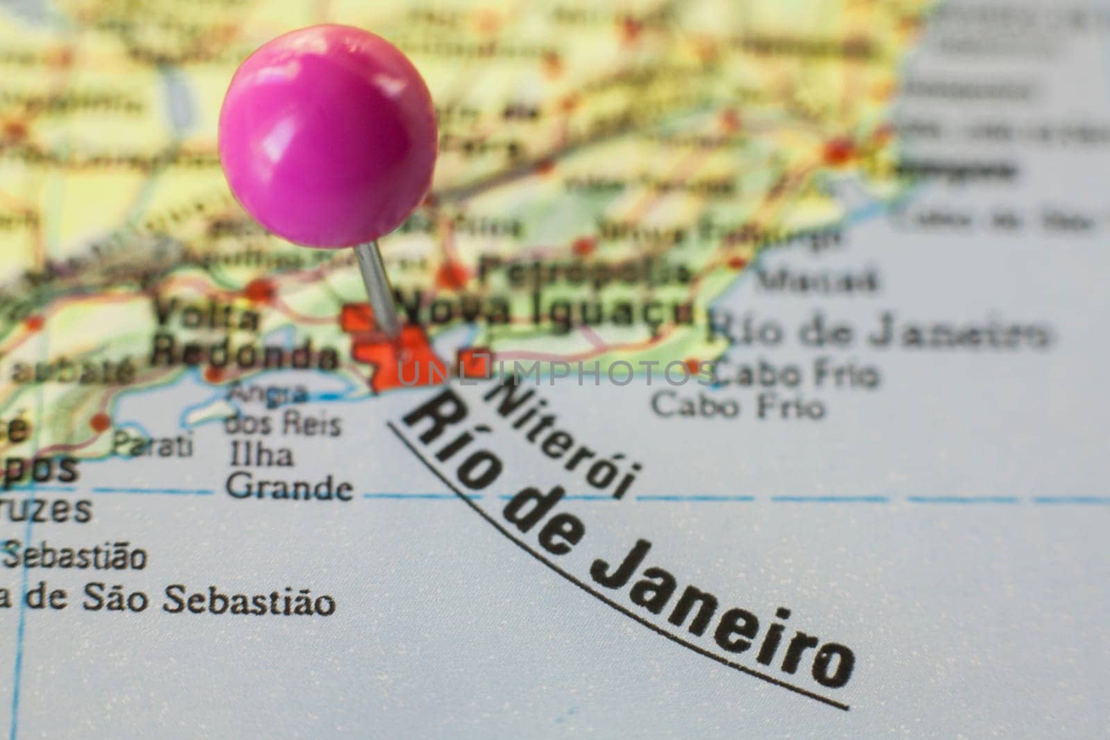 Pushpin marking on Rios de Janeiro, Brazil. Selective focus on city name