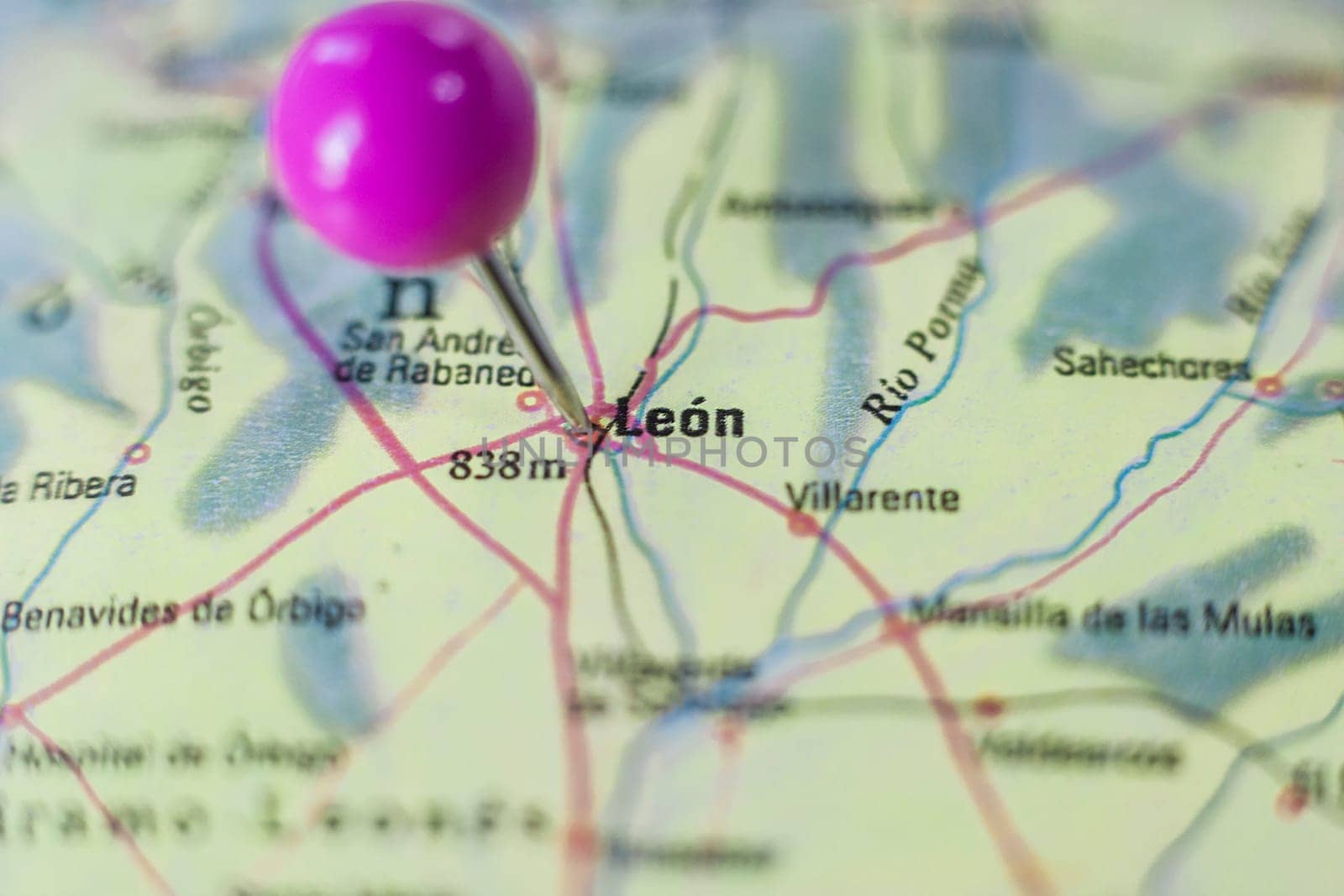 Pushpin marking on Leon, Spain. Selective focus on city name