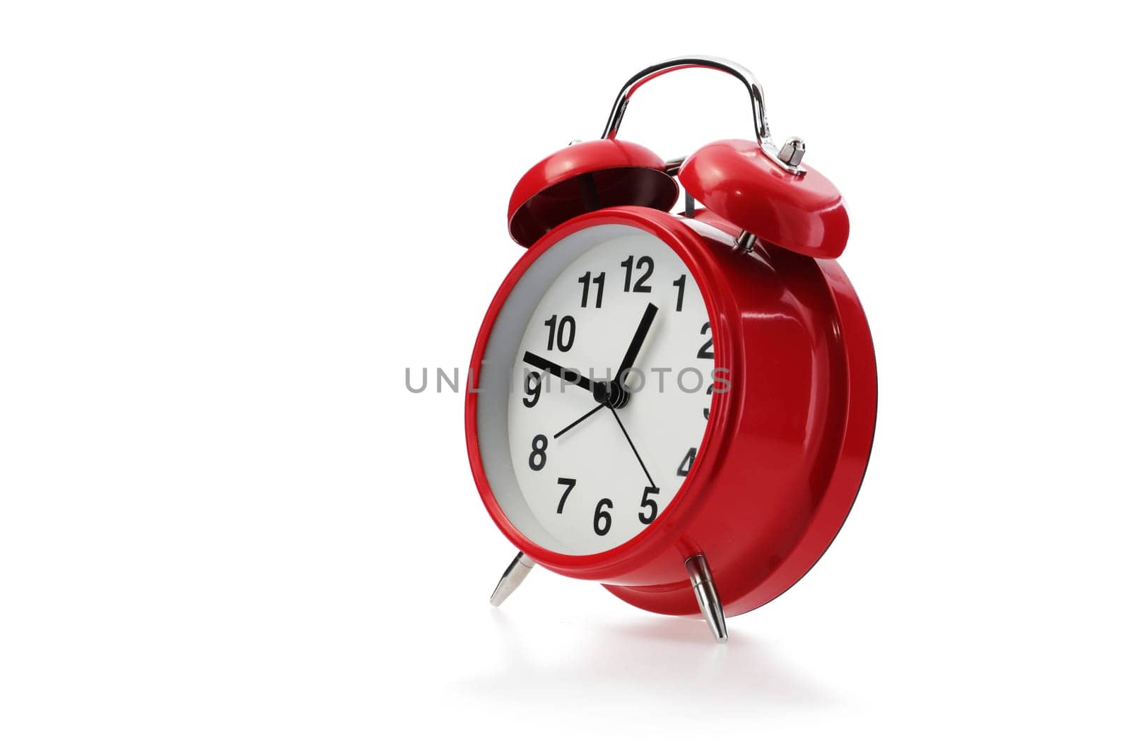 A red retro alarm clock in white with shadow
