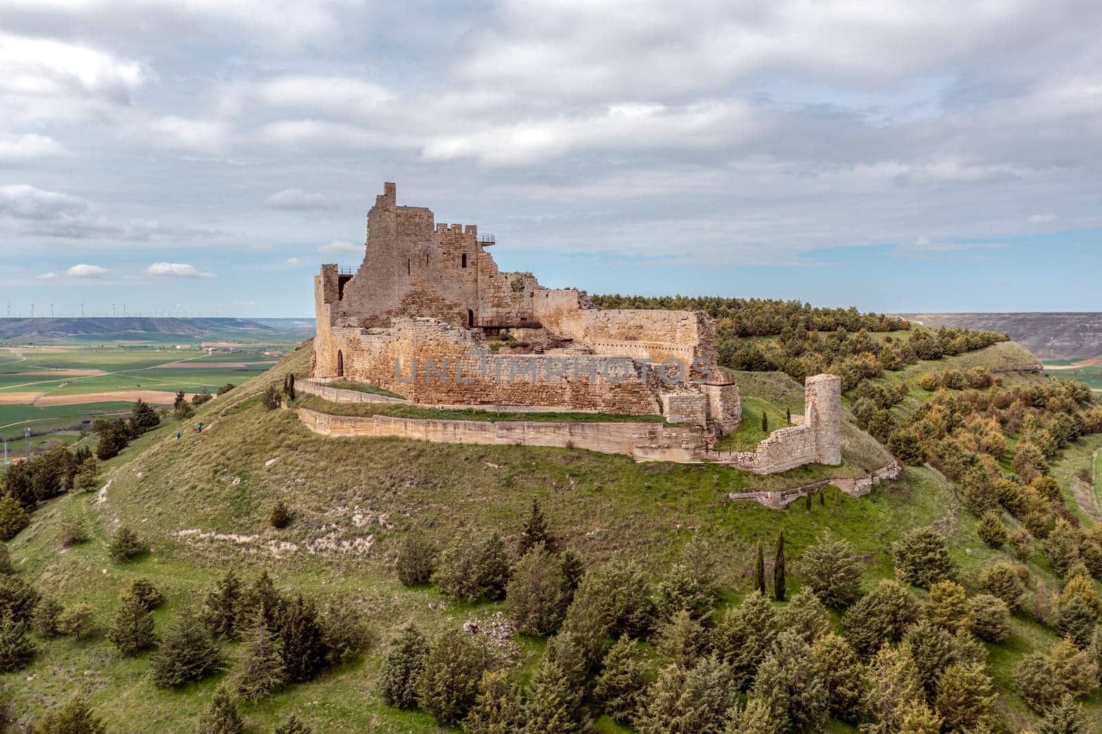 Aerial view of the ruins of an ancient medieval castle in Castrojeriz, Burgos, Spain.