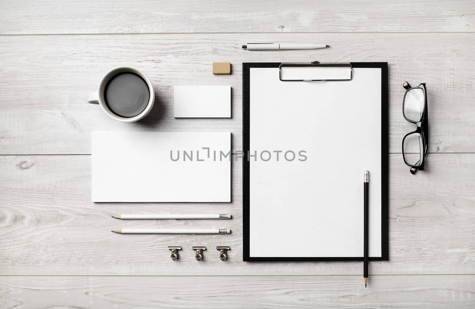 Blank corporate stationery set on light wooden background. Brand identity mockup. Flat lay.