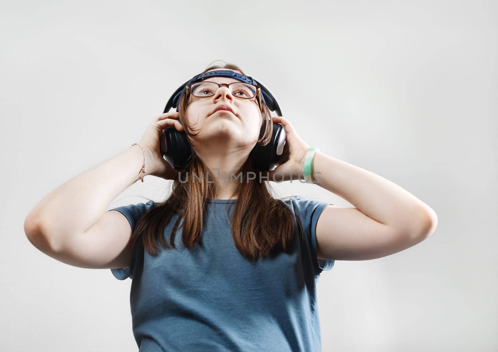 Girl enjoying music with headphones. Teen girl listening to music.