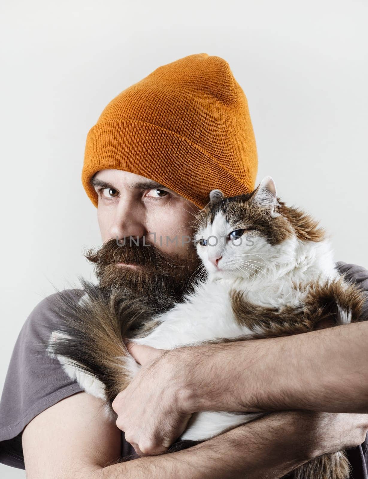 Hipster and cat. Bearded man with his beloved cat.