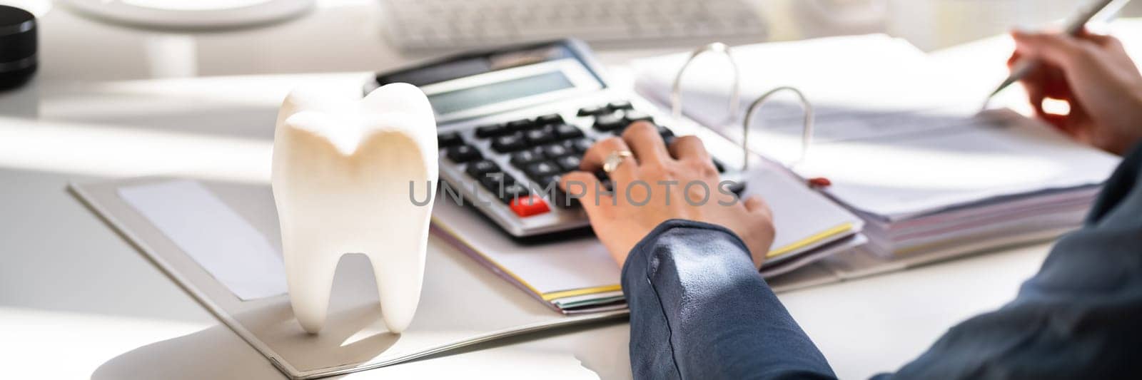 Dentist Bill And Tax Paperwork At Desk