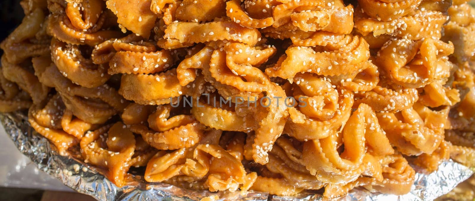 Platter crammed with chebakia. Deep-fried moroccan pastry