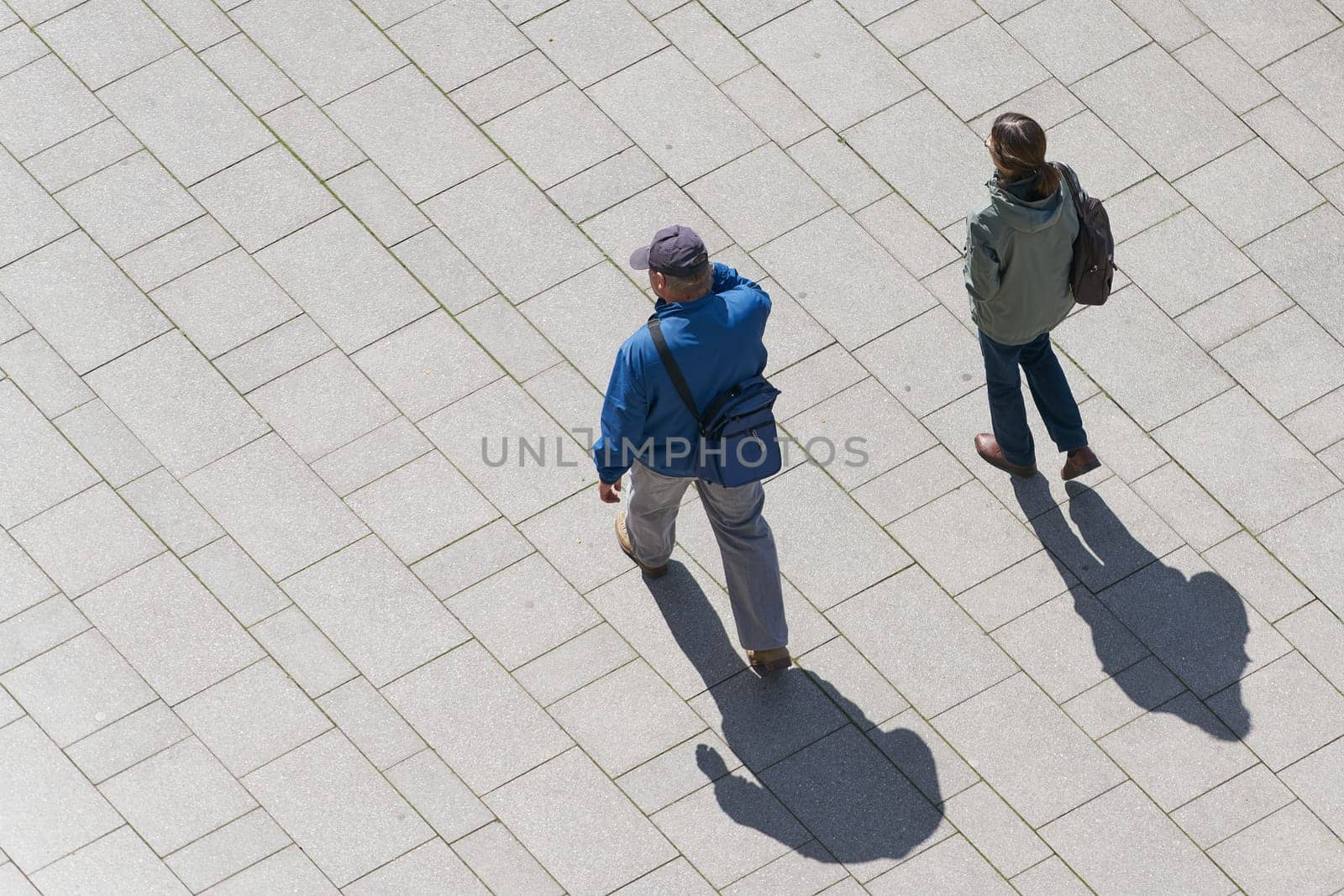 a couple walking through the city center of Magdeburg seen from above
