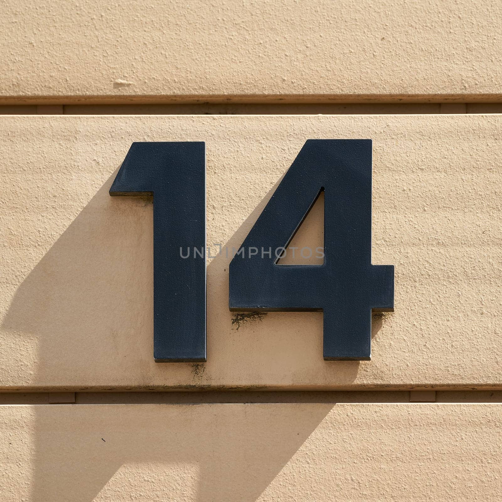 House number 14 on the facade of a house in Magdeburg in Germany