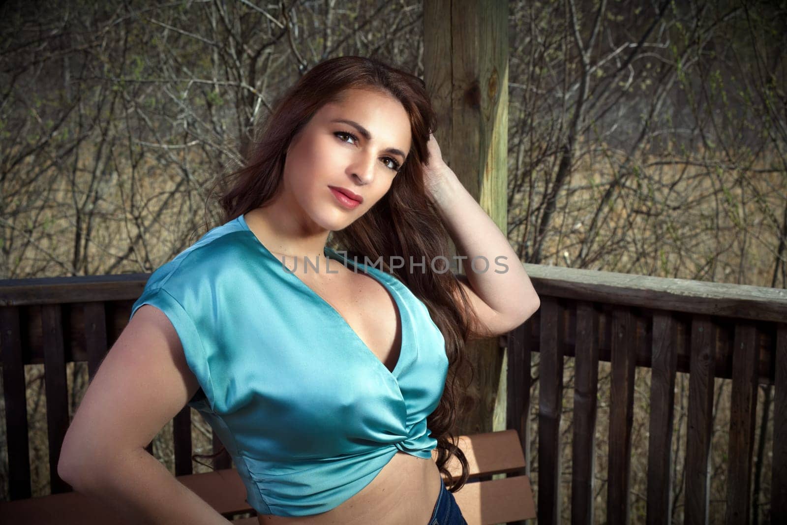 seductive woman outside blue retro style camisole make-up spring forest in a park