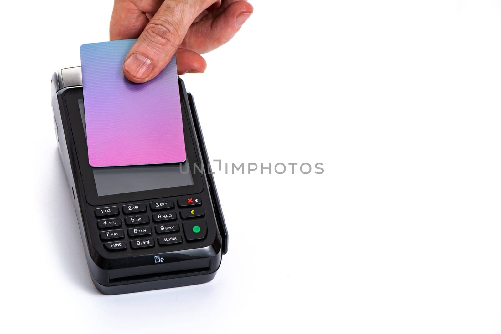 Attached plastic card to the payment terminal with a man's hand on a white isolated background, copy space. High quality photo