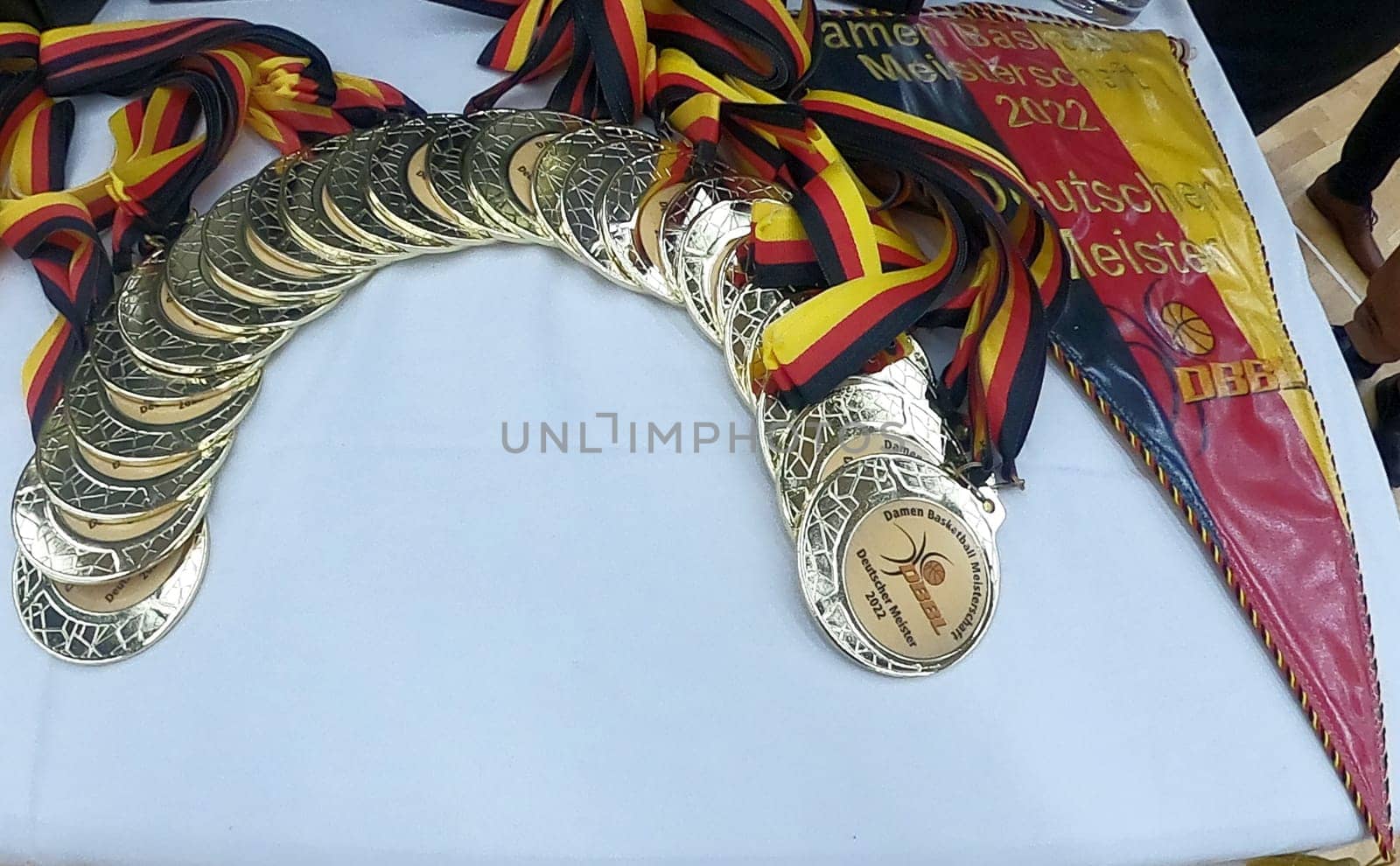 The pennant and the gold medals for the German basketball champion Eisvögel USC Freiburg).. 1.BBL Women 2021/2022 - Eisvoegel USC Freiburg - Rheinland Lions. .. Photo: Joachim Hahne/johapress