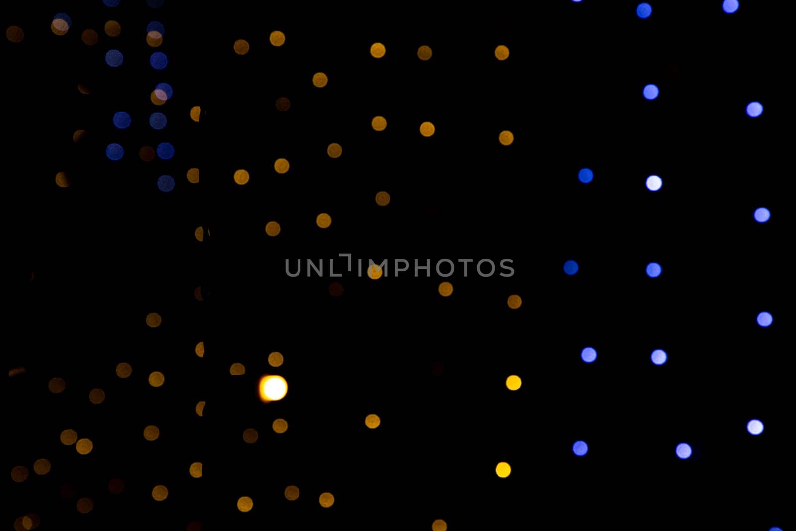 Black background with golden light effects. background with  Blur bokeh effects. Abstract background texture