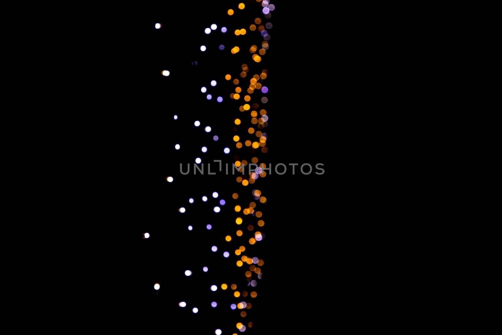 Black background with golden light effects vertical. background with  Blur bokeh effects. Abstract background texture