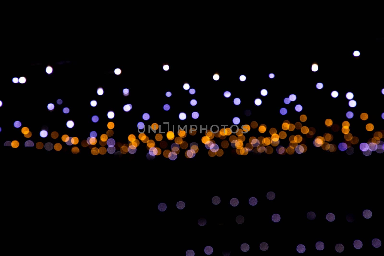 Black background with golden light effects. background with  Blur bokeh effects. Abstract background texture