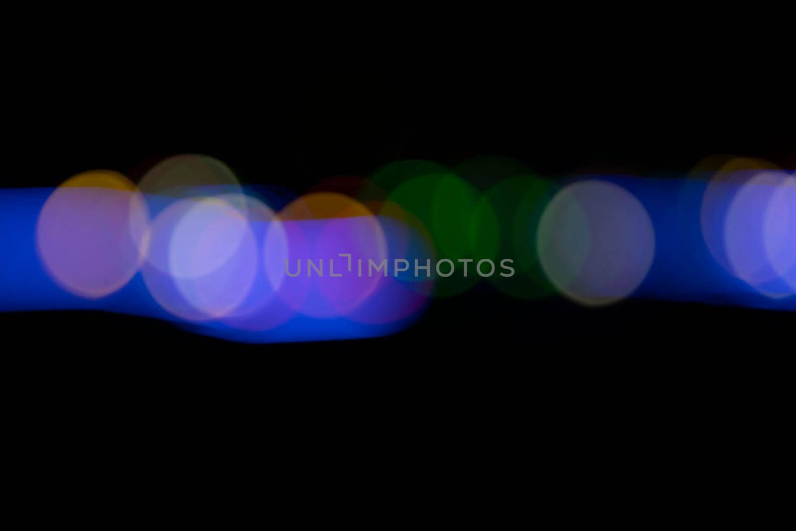 Black background with colorful light effects. background with  Blur bokeh effects. Abstract background texture
