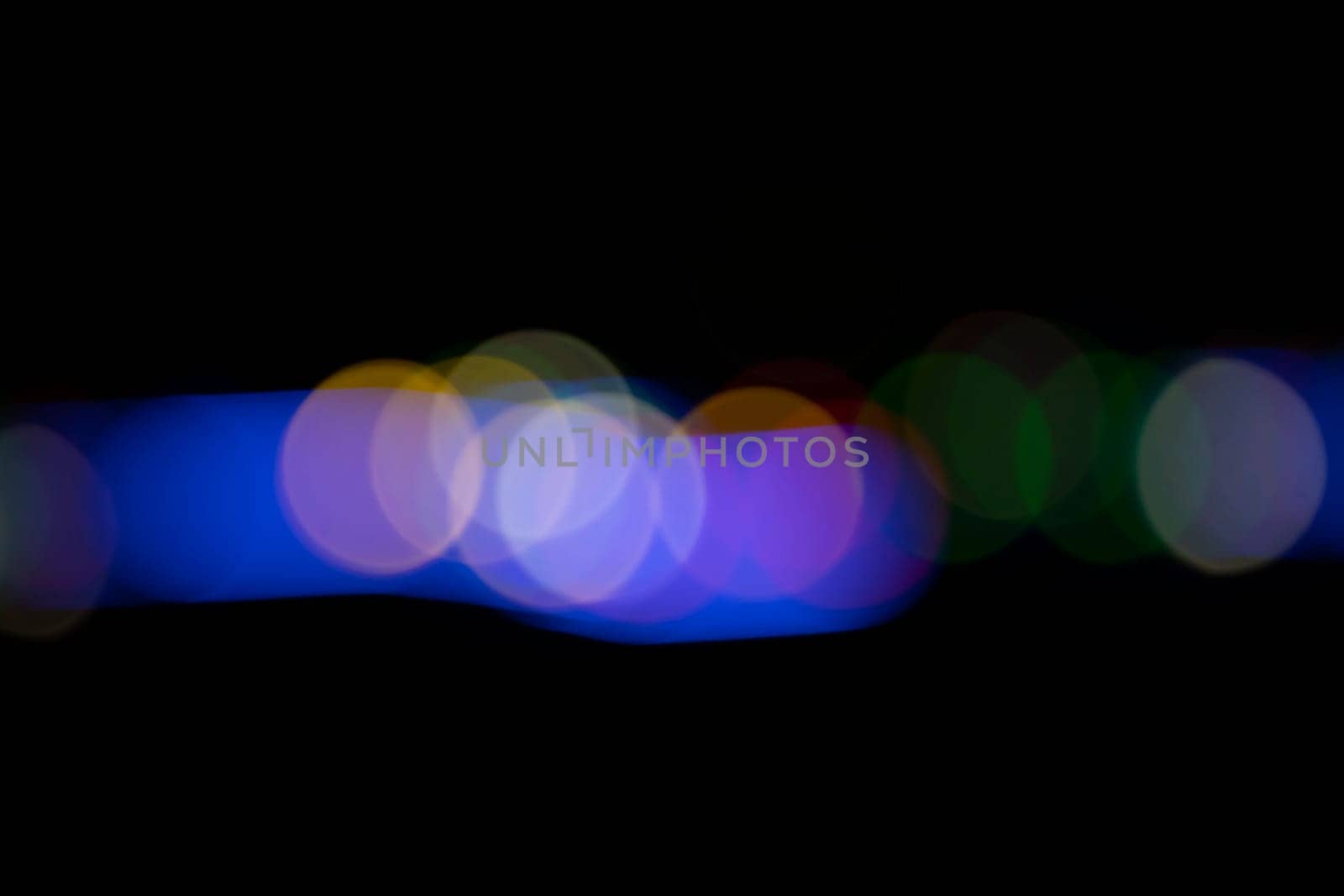 Black background with colorful light effects. background with  Blur bokeh effects. Abstract background texture