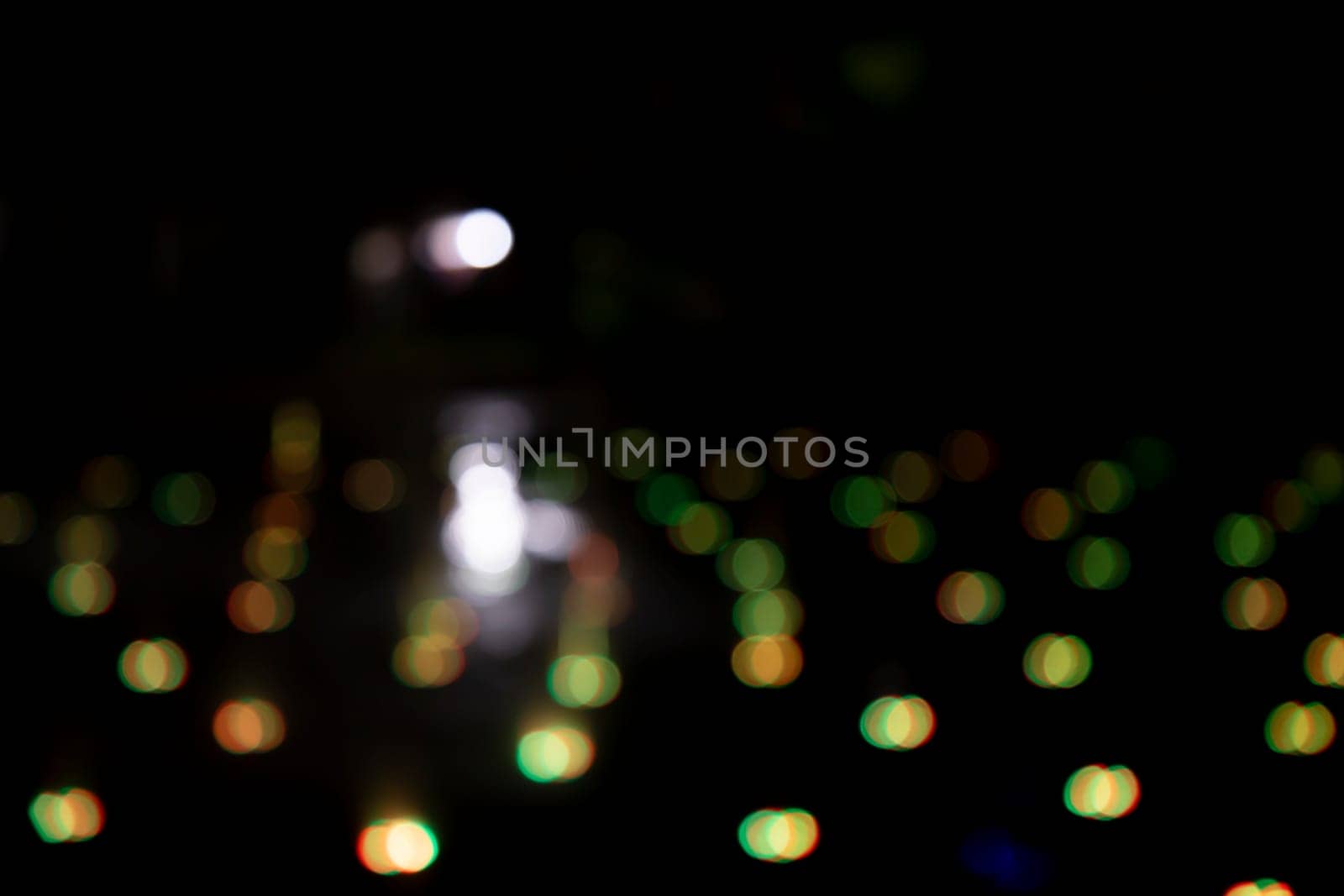 Abstract bokeh light effects on the night. Black background with colorful light effects. background with  Blur bokeh effects. Abstract background texture