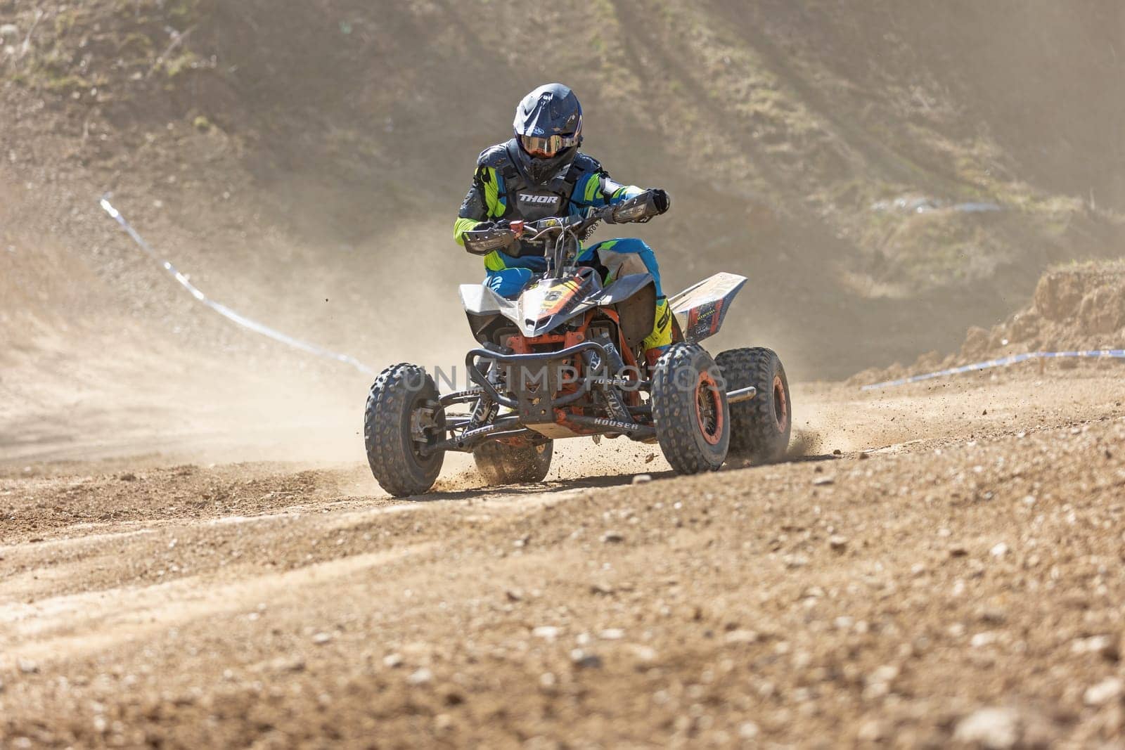 MOHELNICE,  CZECH REPUBLIC - APRIL 16, 2022: Rider on blue  quad bike is driving in International Championship of Czech Republic in Sidecarcross, category Quad on April 16, 2022 in Mohelnice.