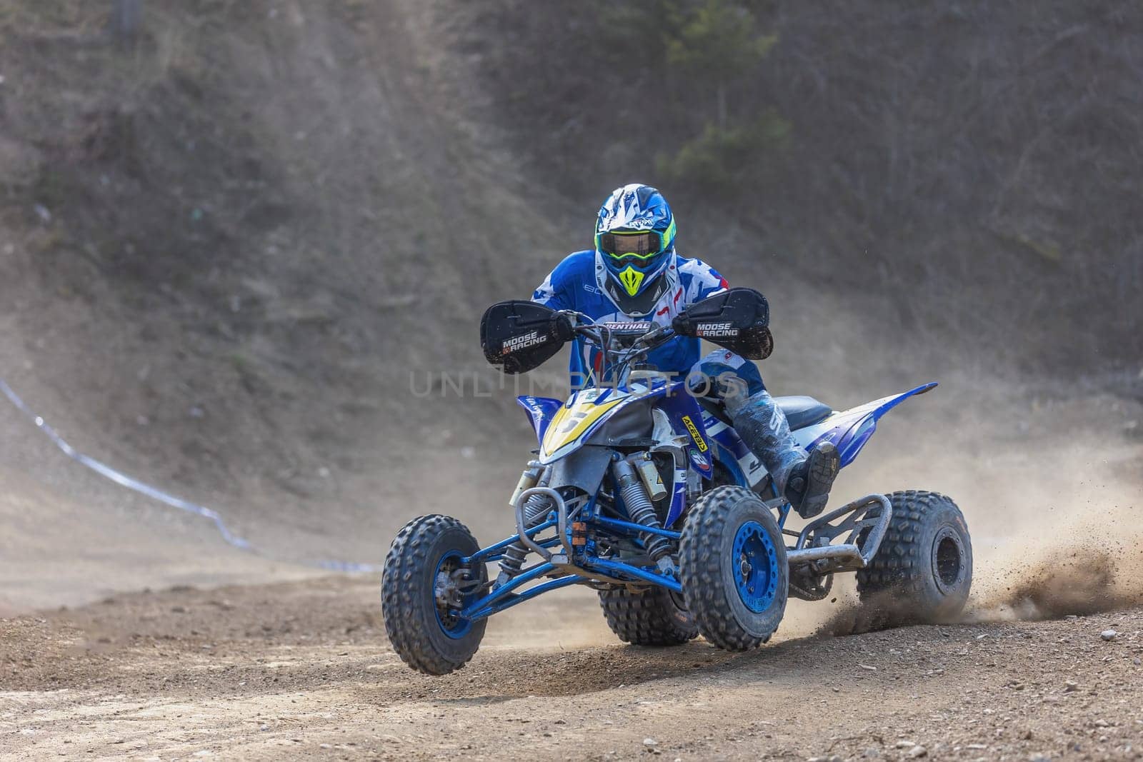 MOHELNICE,  CZECH REPUBLIC - APRIL 16, 2022: Quad bike rider in the race closeup in International Championship of Czech Republic in Sidecarcross, category Quad on April 16, 2022 in Mohelnice.