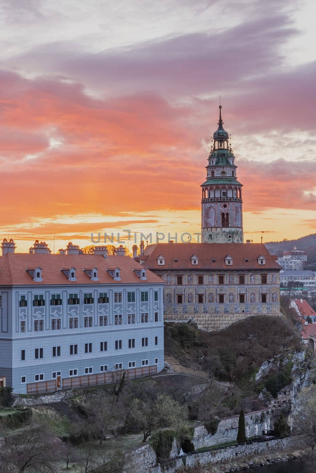 Beautiful view to Cesky Krumlov castle and its tower in Czech republic at dawn. Vertically.